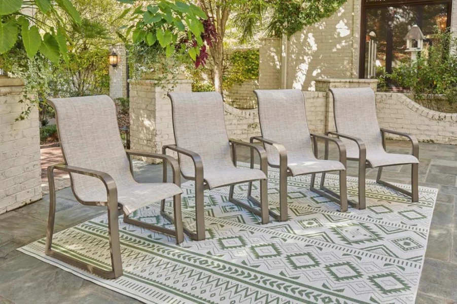 Signature Design by Ashley Light Brown Faux Leather Outdoor Stackable Sling Chair, Set of 4, Beach Front Casual Armchair
