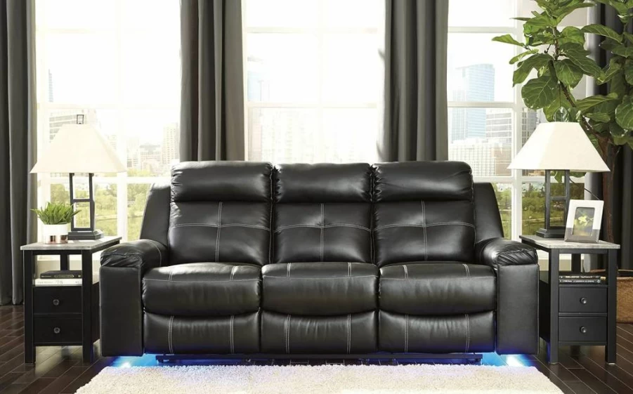 Signature Design by Ashley Kempten Black Faux Leather Manual Reclining Sofa with High Back & Blue LED Lighting