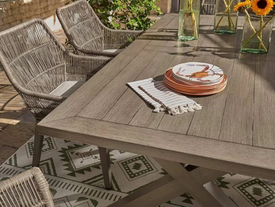 Signature Design by Ashley Light Brown Outdoor Dining Table with Umbrella Hole - Beach Front Casual Patio Furniture