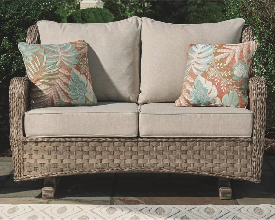 Signature Design by Ashley Light Brown Outdoor Loveseat Glider with Wicker Frame, Cushioned Seat & 2 Throw Pillows